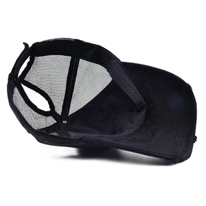 Black ponytail trucker hat for women with breathable mesh back and adjustable strap closure