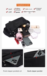 Detailed interior storage layout of black nylon crossbody bag showing multiple pockets