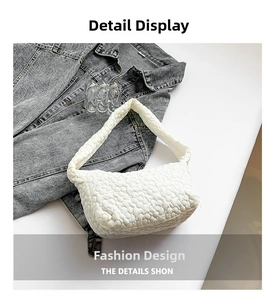 Macro shot of white quilted puffy shoulder bag texture with soft bubble pattern finish