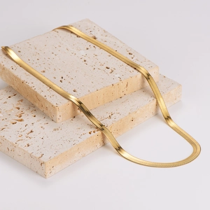 5.7mm wide flat snake chain necklace in 18K gold plated stainless steel on stone