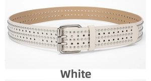 Detail of white punk belt with silver star cutouts and metal rivet decorations