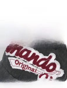 Detail of the vintage distressed baseball cap featuring red towel embroidered Orlando text