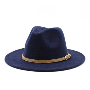 Detail of dark blue woolen jazz hat with beige belt buckle and wide brim structure