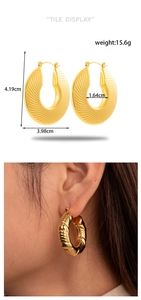 Detail of golden textured hoop earrings with dimensions 4.19cm and model on-ear view