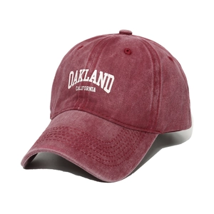 Vintage washed burgundy baseball cap featuring Oakland California embroidery in white