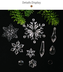 Detailed display of assorted clear acrylic Christmas snowflakes and icicle pendants