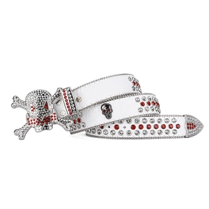 Detailed macro of white crocodile leather belt with rhinestone skull buckle and metal studs