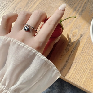 925 sterling silver beaded ring with heart pendant on model in lifestyle setting