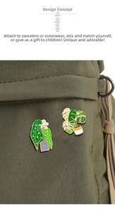 Detail of creative plant enamel pins featuring green leaves on olive canvas bag surface