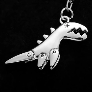 3D metallic dinosaur keychain in silver finish with a sleek minimalist design