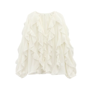 Flat lay of a white V-neck chiffon shirt with layered ruffles and button-front detailing