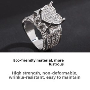 Close-up of luxury heart ring featuring pavé-set zircon crystals and vintage layered design