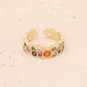 Adjustable gold crown ring set with colorful zircon stones on a natural stone base