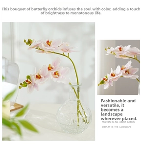 Detailed view of pink artificial orchid petals with gradient colors in a glass vase