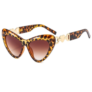 Fashionable leopard cat-eye sunglasses with brown gradient lenses and gold heart details