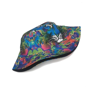 Detailed view of colorful tiger print bucket hat with abstract art pattern and black trim