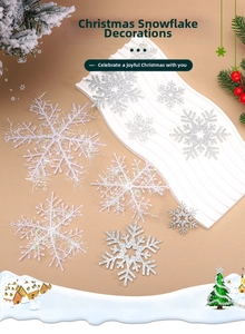 Close-up of sparkling silver glitter and iridescent snowflake ornaments for Christmas trees