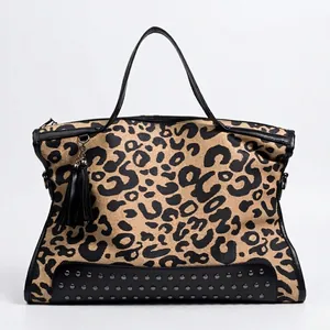 Fashionable leopard print handbag with black leather trim and stud details for women