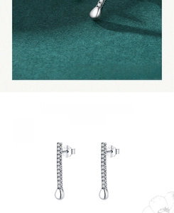 Macro view of S925 sterling silver teardrop earrings featuring pavé stones and hallmarks