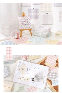 Close-up of pastel grid memo notes in purple, pink, and blue for journaling and scrapbooking