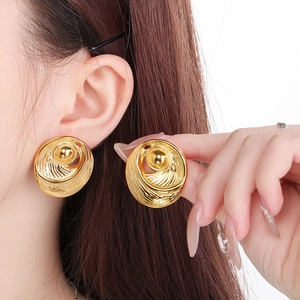 Elegant 18k gold-plated stainless steel round spiral stud earrings worn by model