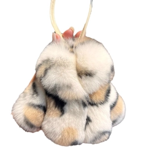 Plush tricolor rabbit fur keychain with soft black white brown faux fur and lanyard