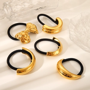 Detail of 5-piece set featuring 18K gold-plated bow and geometric hair ties on white base