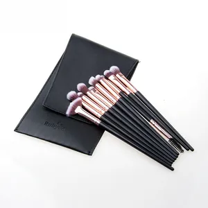 Close-up of 10-piece makeup brush set with rose gold ferrules and a black pouch