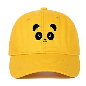 Detailed close-up of yellow cotton baseball cap featuring minimalist panda face embroidery