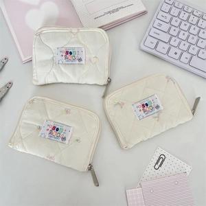 Quilted fabric coin purses with colorful heart embroidery and secure zipper closure