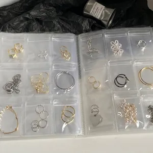 Transparent PVC jewelry organizer book with multiple pockets for anti-oxidation earring storage