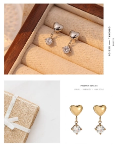 Detail view of heart-shaped earrings with tassel zircons in gold and silver finishes