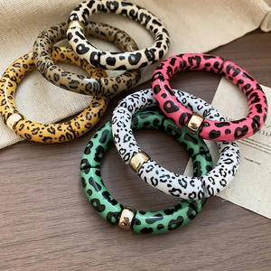 Variety of leopard print acrylic stretch bracelets with gold metallic square charms