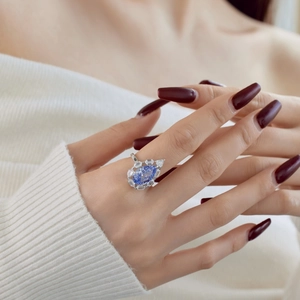 S925 sterling silver ring featuring a large pear-cut blue zircon with white diamond halo