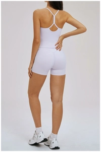 Detail of cross-back yoga tank top and high-waisted shorts in light purple sports set