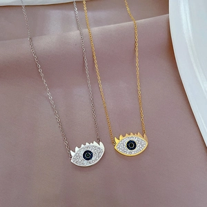 Titanium steel evil eye pendant necklace in gold and silver plating with blue crystals