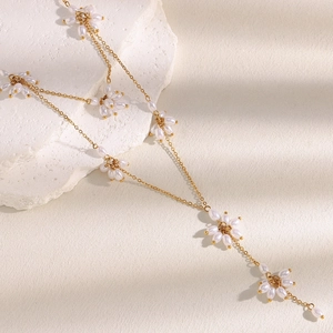 Elegant 18K gold plated flower necklace and earring set with pearls on white stone