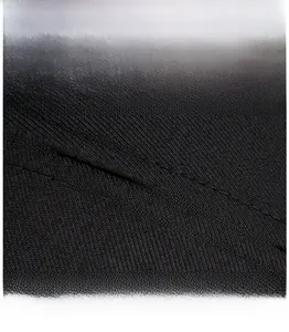 Macro shot of twill fabric and neat stitching detail on a black business baseball cap