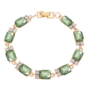 Elegante bracciale dorato con gemme rettangolari verde smeraldo e dettagli in cristallo