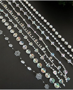 Detailed macro view of assorted iridescent transparent acrylic beads for Christmas decor
