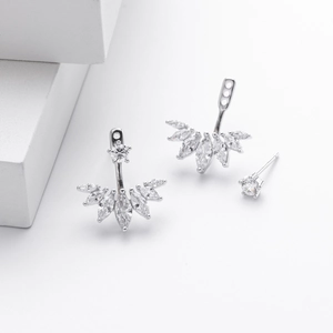 Macro shot of S925 silver stud earrings with detachable zircon jacket and round cut stone