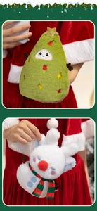 Detail of soft plush Christmas tree and reindeer toys with colorful festive embroidery