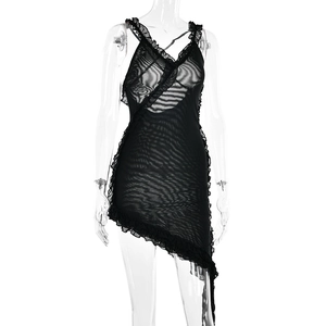 Detail view of black sheer mesh dress with ruffle trim and asymmetric hemline