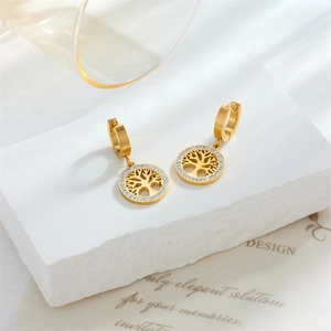 Golden Tree of Life drop earrings with sparkling crystals on a minimalist stone base