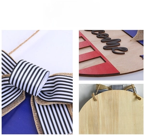 Detail of wooden welcome sign with 4th of July bow and textured 3D lettering