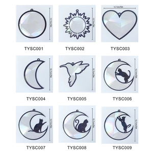 Detailed grid of holographic suncatcher prisms in nine assorted geometric and cat shapes