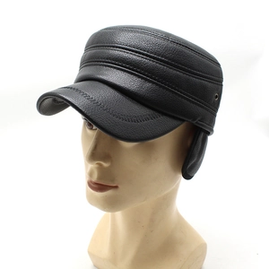 Detail of black faux leather flat cap with ear flaps and decorative stitching