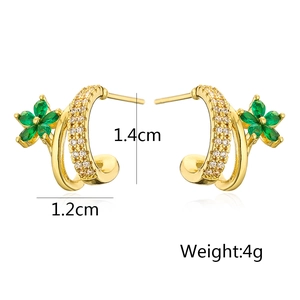 Detail showing 18K gold plated C-shaped earrings with green flowers and zircons 1.4cm size