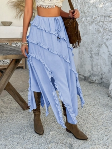 Detail of blue ruffle skirt with layered asymmetric hem and drawstring elastic waist