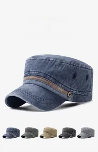 Detail view of washed cotton cadet cap showing metal button accents and fabric texture